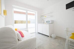 Twin kamer, 1 slaapkamer | Woonkamer | Flatscreentelevisie