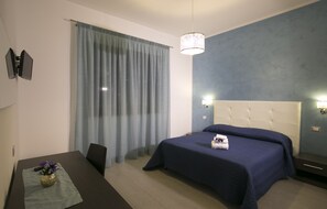 Panoramic Quadruple Room, Balcony | Free minibar items, desk, soundproofing, cots/infant beds