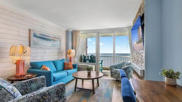 Deluxe Condo, 1 Bedroom, Ocean View, Oceanfront (1005) | Living area | TV, DVD player