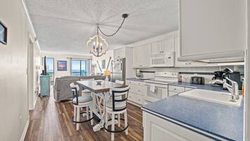 Condo, 2 Bedrooms, Oceanfront, Balcony (D2) | Private kitchen | Toaster, cookware/dishes/utensils, dining tables