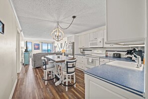 Condo, 2 Bedrooms, Oceanfront, Balcony (D2) | Private kitchen | Toaster, cookware/dishes/utensils, dining tables - Long Bay Dunes by Elliott Beach Rentals (Myrtle Beach)