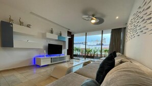 Apartment, Multiple Beds, City View (DCA01 Spectacular n cozy condo w outd) | Living area | 55-inch flat-screen TV with cable channels, TV - Doca By Playa Moments (Playa del Carmen)