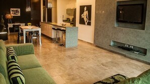 Apartment, Multiple Beds, City View (DCA01 Spectacular n cozy condo w outd) | Living room | 55-inch flat-screen TV with cable channels, TV - Doca By Playa Moments (Playa del Carmen)