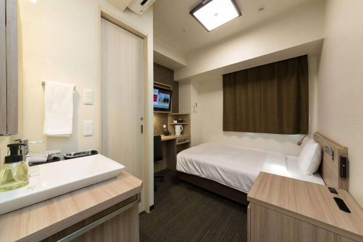 Down duvets, desk, laptop workspace, iron/ironing board