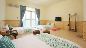 A hotel room with two beds, a television, and a wooden wardrobe. - 3520 B&B (Taitung)