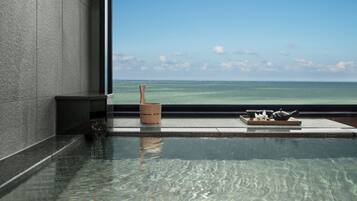 Executive Suite, 1 Bedroom, Ocean View | Bathroom | Combined shower/tub, free toiletries, hair dryer, slippers