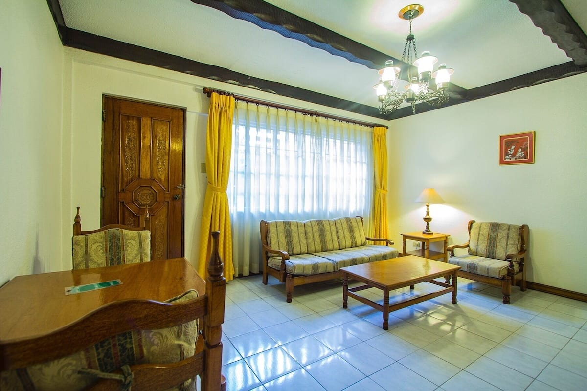 Deluxe Single or Double Room | Living area | Flat-screen TV