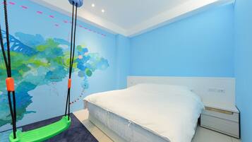 A bedroom with a bed, a nightstand, a green swing, and a wall mural.