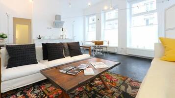 Premium Apartment, 1 Bedroom, Kitchen (final cleaning fee included) | Living area | Smart TV, books, first-run movies