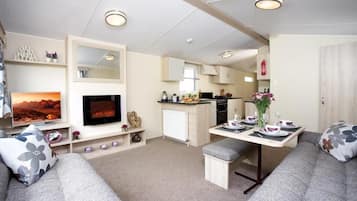 Comfort Mobile Home, 2 Bedrooms, Ground Floor | Living area | Flat-screen TV, fireplace