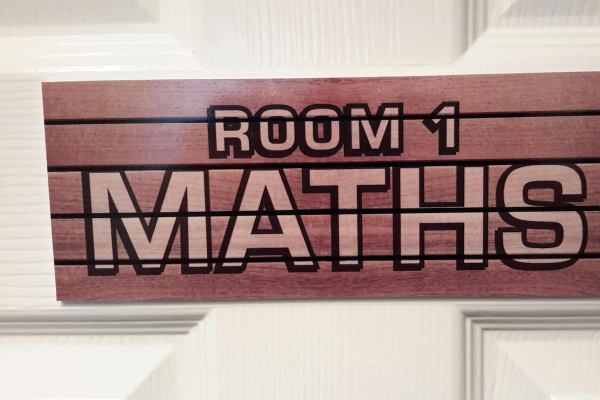 A sign indicating 'ROOM 1 MATHS'.