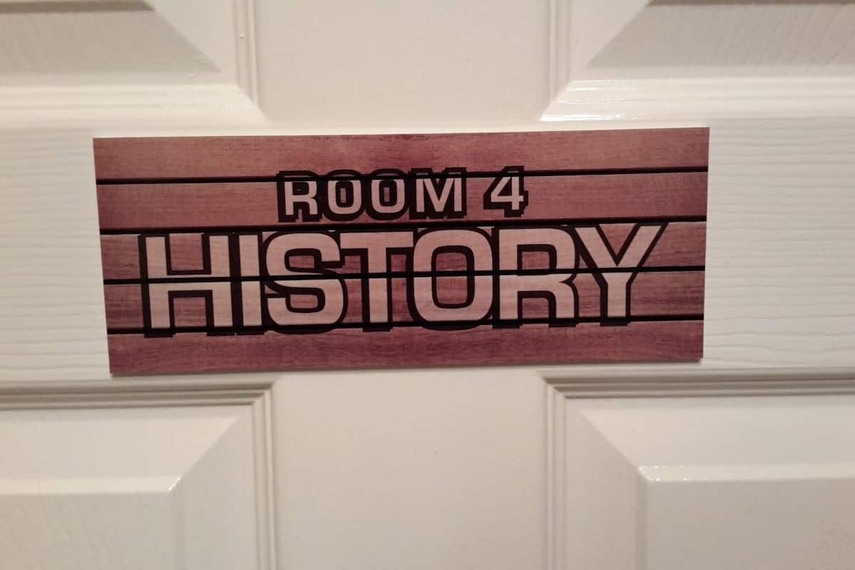 A sign on a door indicating "ROOM 4 HISTORY".