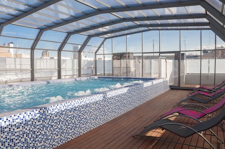 Indoor pool, pool loungers. Funway Academic Resort - Adults Only