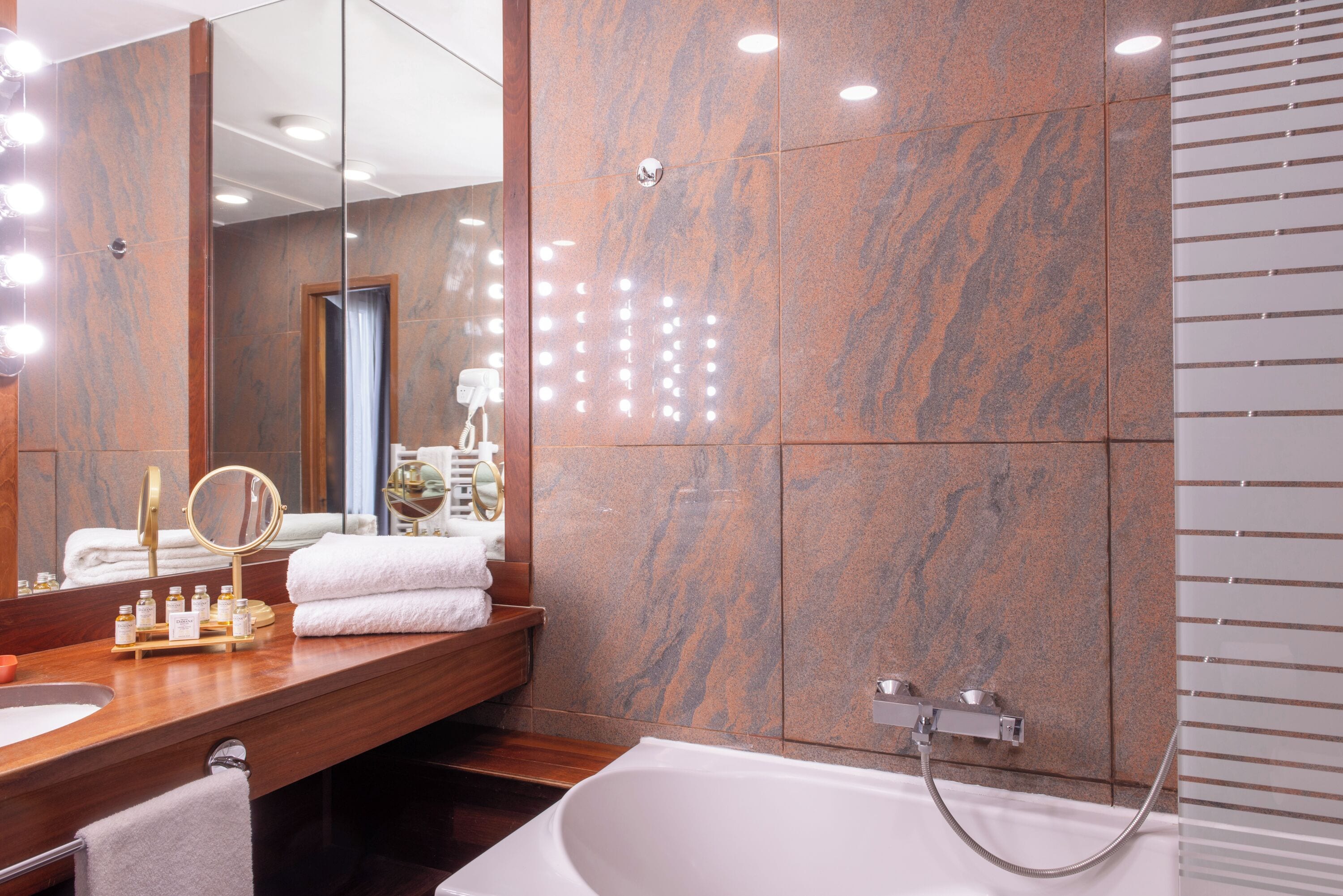 bathtub, free toiletries, hair dryer, towels