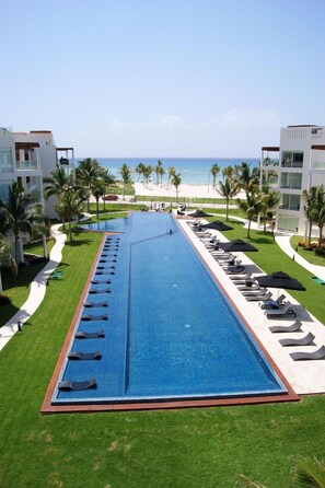 Apartment, Multiple Beds, Pool View (EG818 Elements Condos 2 Bedroom) | Pool | Outdoor pool, open 9:00 AM to 8:00 PM, pool umbrellas, sun loungers