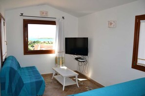 Apartment, 2 Bedrooms | Living area | 42-inch LCD TV with digital channels, TV, DVD player