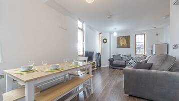 Deluxe Apartment, 2 Bedrooms | Living area | Flat-screen TV