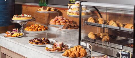 A bakery display with various baked goods.