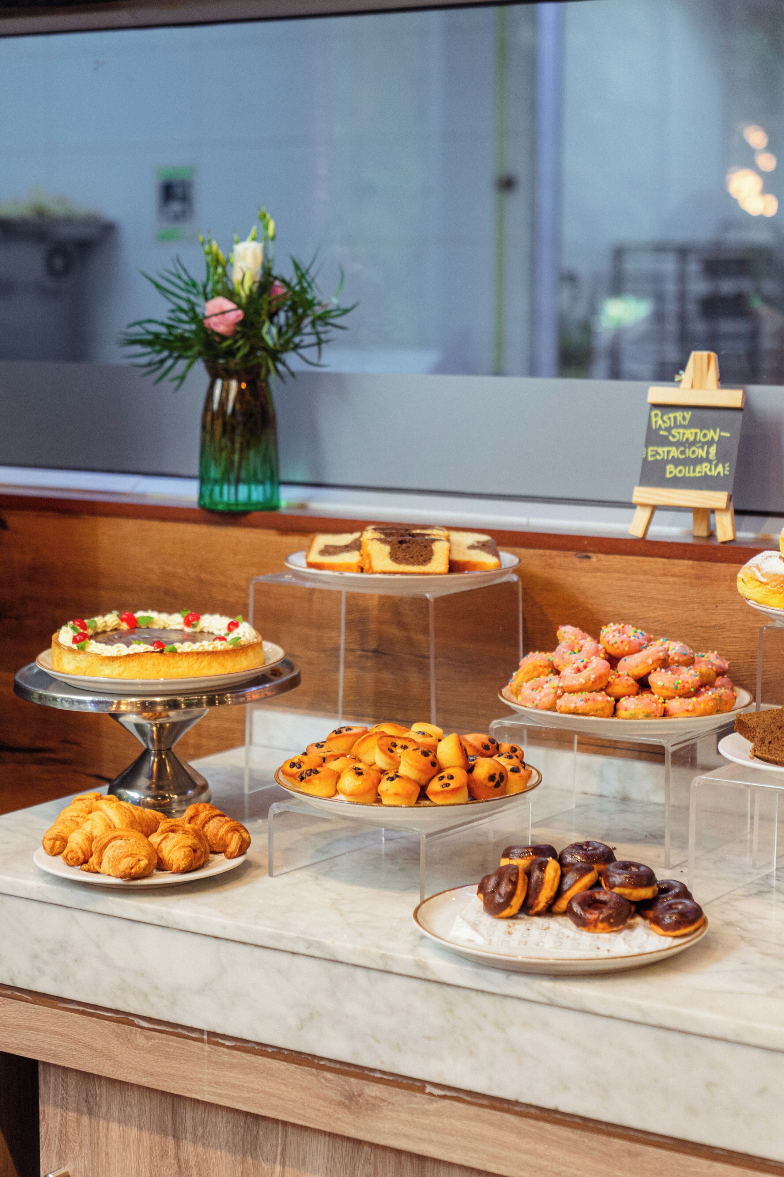A dessert display with various pastries and cakes.