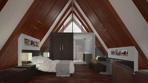 A modern loft bedroom with a sloped ceiling, wooden beams, a bed, a desk, a chair, and artwork on the walls. - Liyya Water Villas (Dambulla)