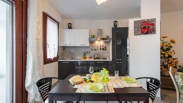 Apartment, 2 Bedrooms | Private kitchen | Full-size fridge, microwave, stovetop, dishwasher