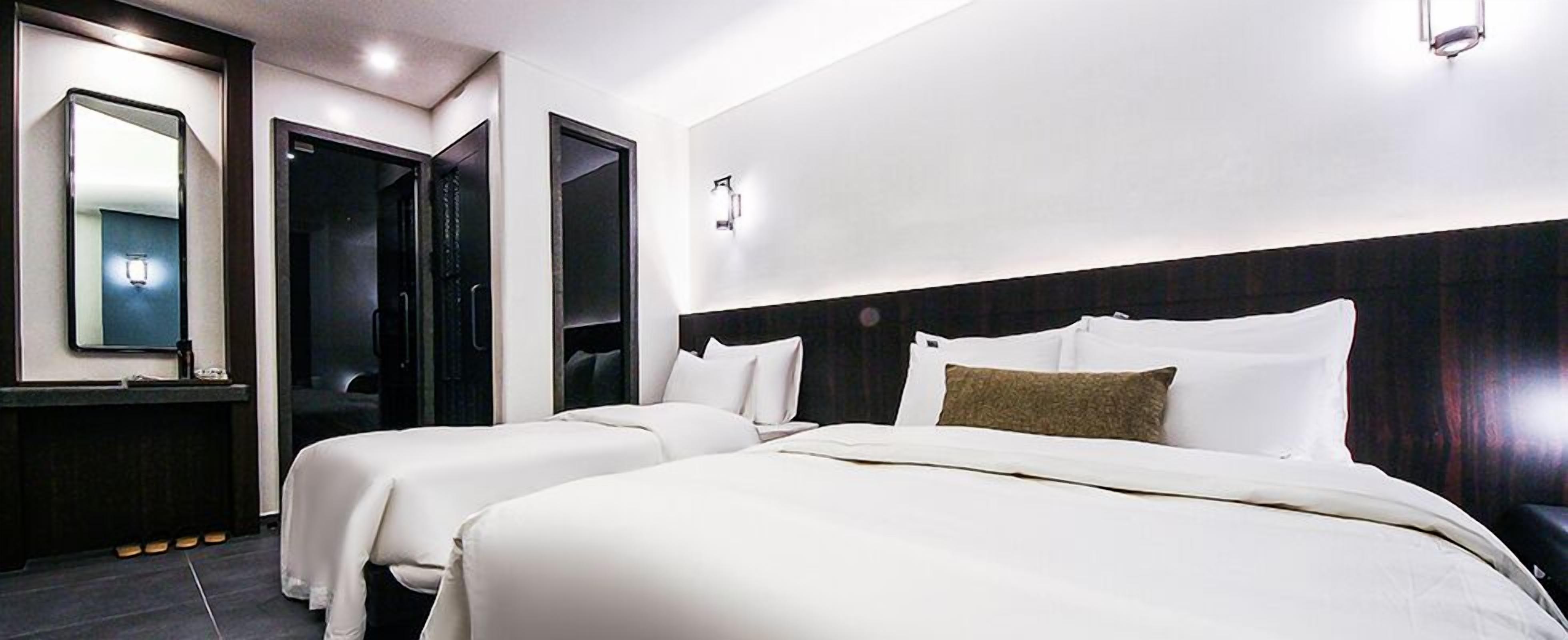 deluxe twin room (for 3 people mixed gender stay, family only allowed) | in-room safe, soundproofing, free wifi, wheelchair access