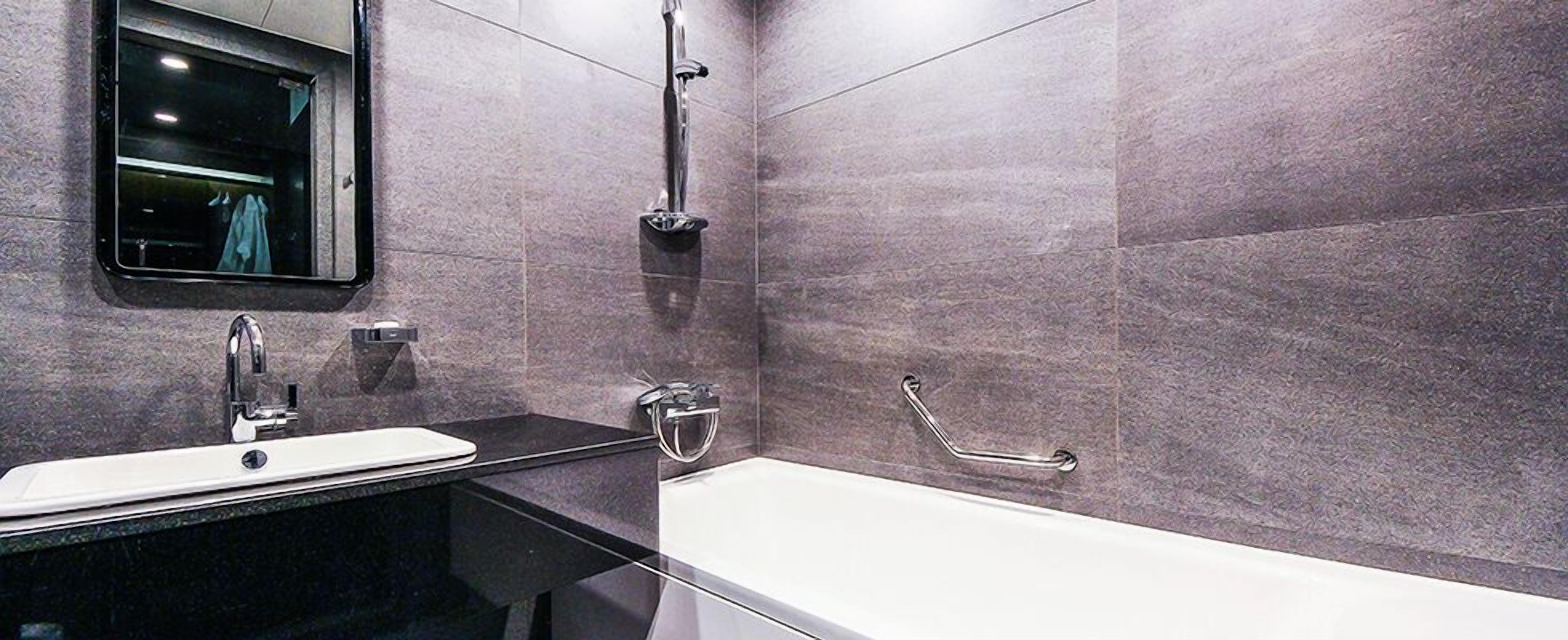 standard twin room (for 3 people mixed gender stay, family only allowed) | bathroom | free toiletries, towels