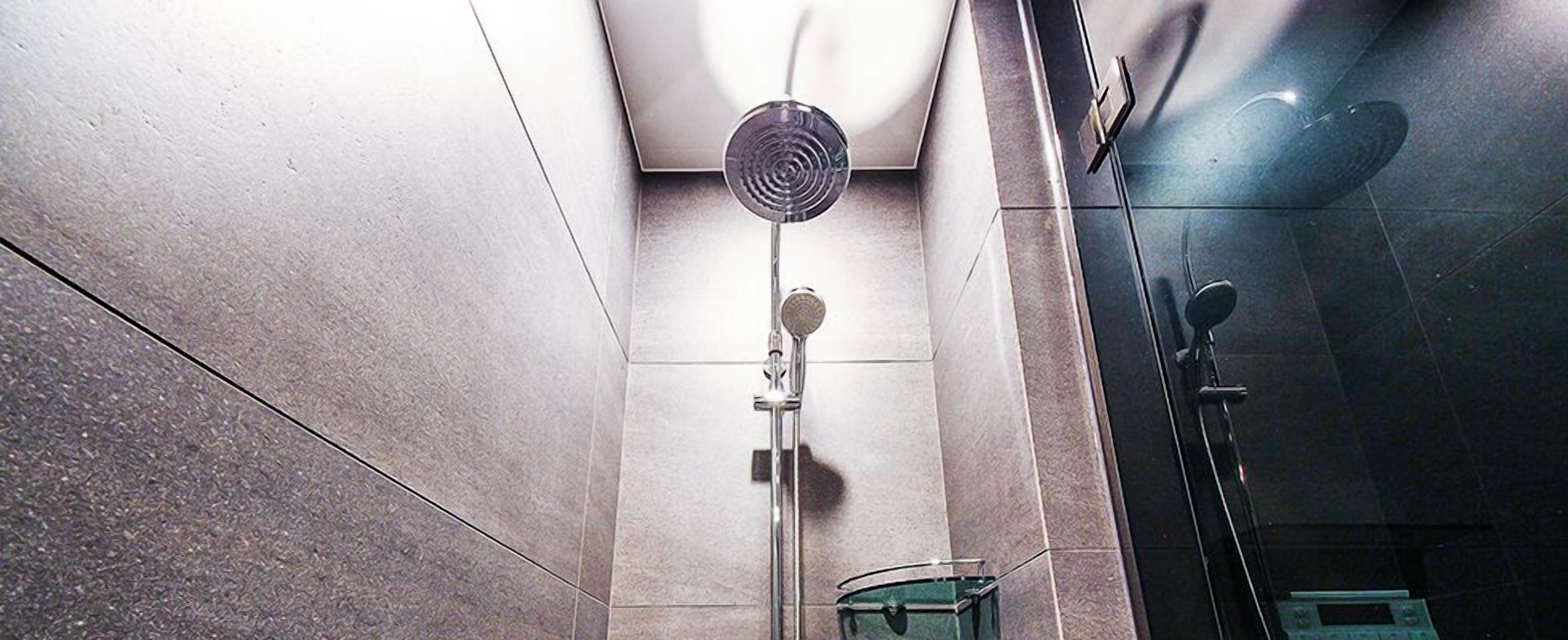 deluxe twin room (for 3 people mixed gender stay, family only allowed) | bathroom shower