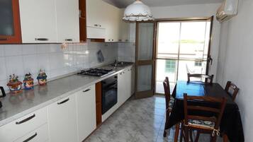 Apartment, 2 Bedrooms (Gomez 2) | Private kitchen | Full-size fridge, stovetop, cookware/dishes/utensils