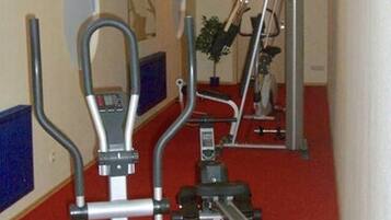 A fitness room with treadmills and exercise equipment.