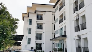 A multi-story residential building with balconies, large windows, and a flat facade. - B2 Korat Boutique & Budget Hotel (Nakhon Ratchasima)