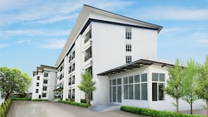 A modern multi-story building with a flat roof, large windows, and a covered entrance area. - B2 Korat Boutique & Budget Hotel (Nakhon Ratchasima)