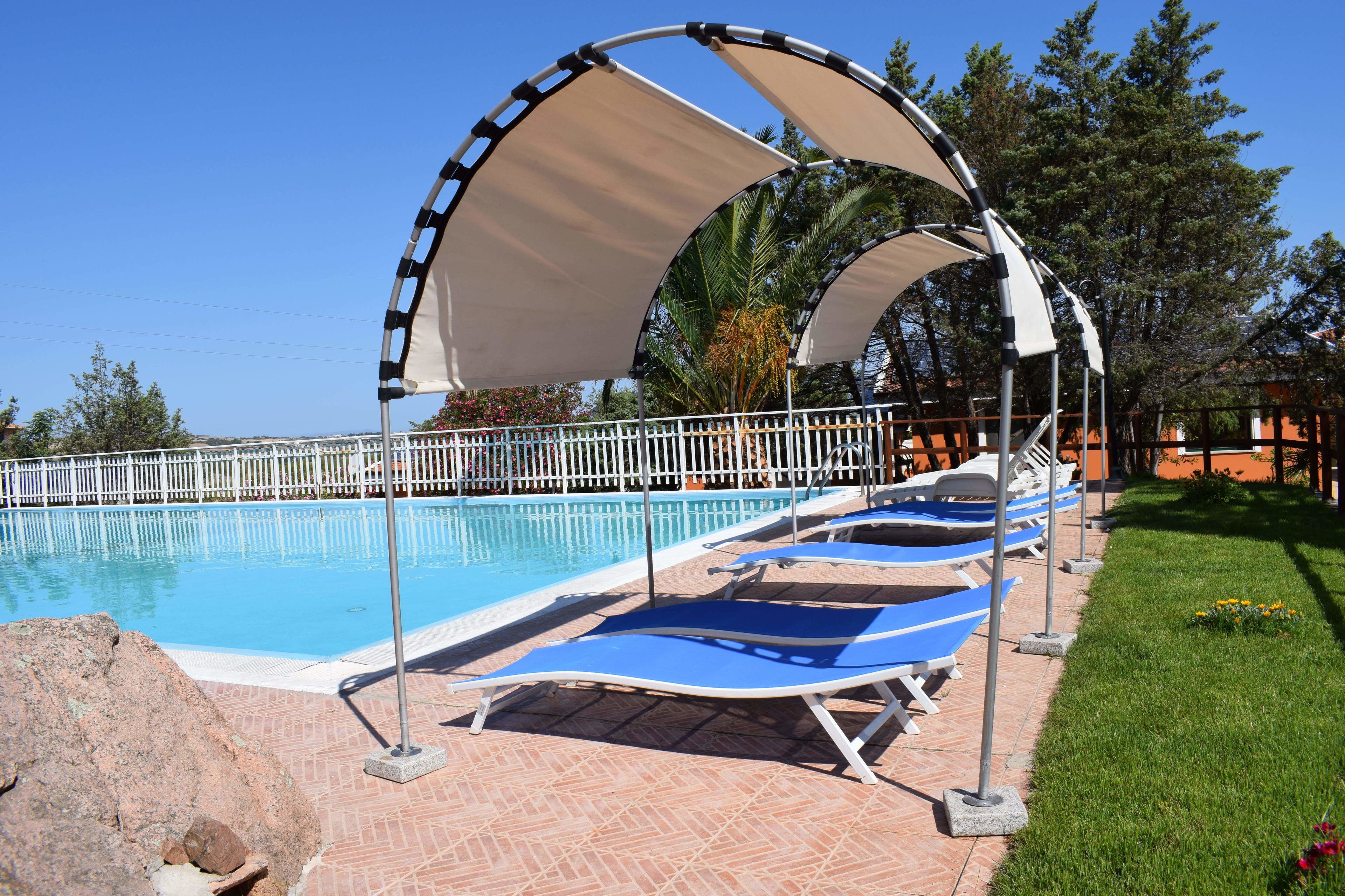 outdoor pool, pool umbrellas, pool loungers