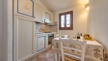 Villa, 2 Bedrooms | Private kitchen | Full-size fridge, oven, stovetop, cookware/dishes/utensils