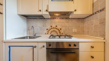 Villa, 2 Bedrooms | Private kitchen | Full-size fridge, oven, stovetop, cookware/dishes/utensils