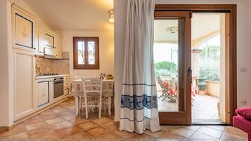 Villa, 2 Bedrooms | Private kitchen | Full-size fridge, oven, stovetop, cookware/dishes/utensils
