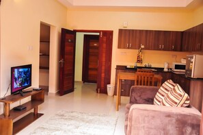 Flat-screen TV - Kampala Suites (Kampala)
