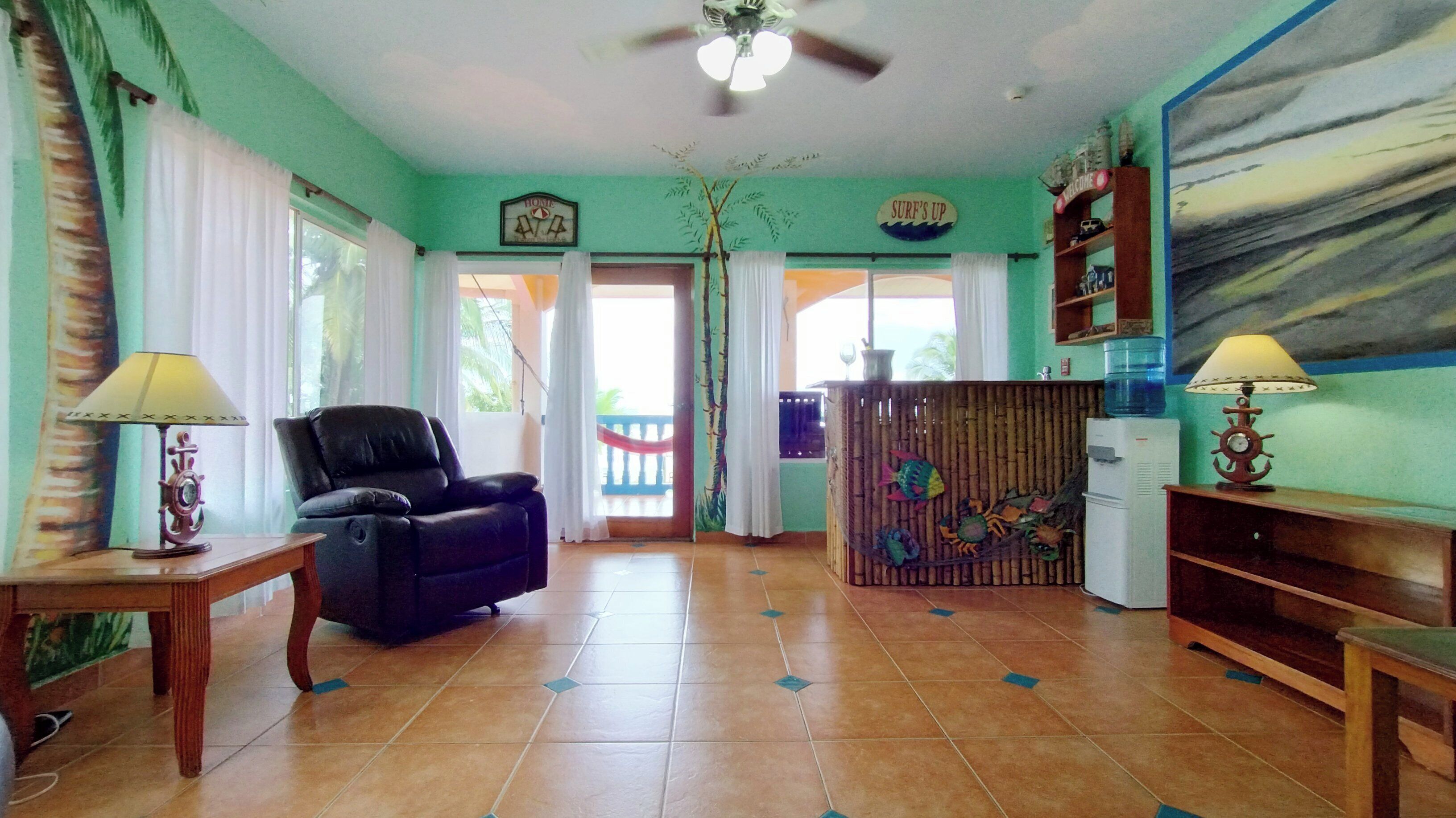 suite, ocean view | living area | flat-screen tv