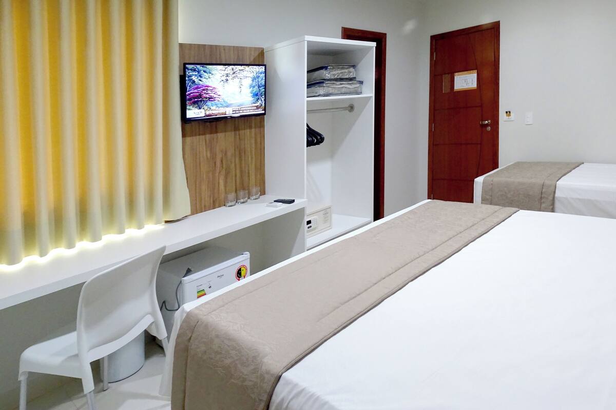 standard triple room | 1 bedroom, minibar, desk, blackout curtains