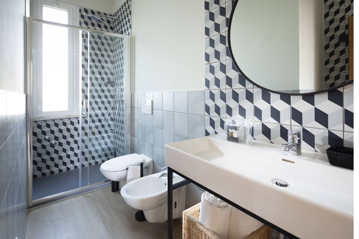 superior double room | bathroom | shower, free toiletries, hair dryer, bathrobes