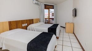 A hotel room with two beds, a TV, and a small wooden cabinet. - Casa Blanca Park (Porto Seguro)