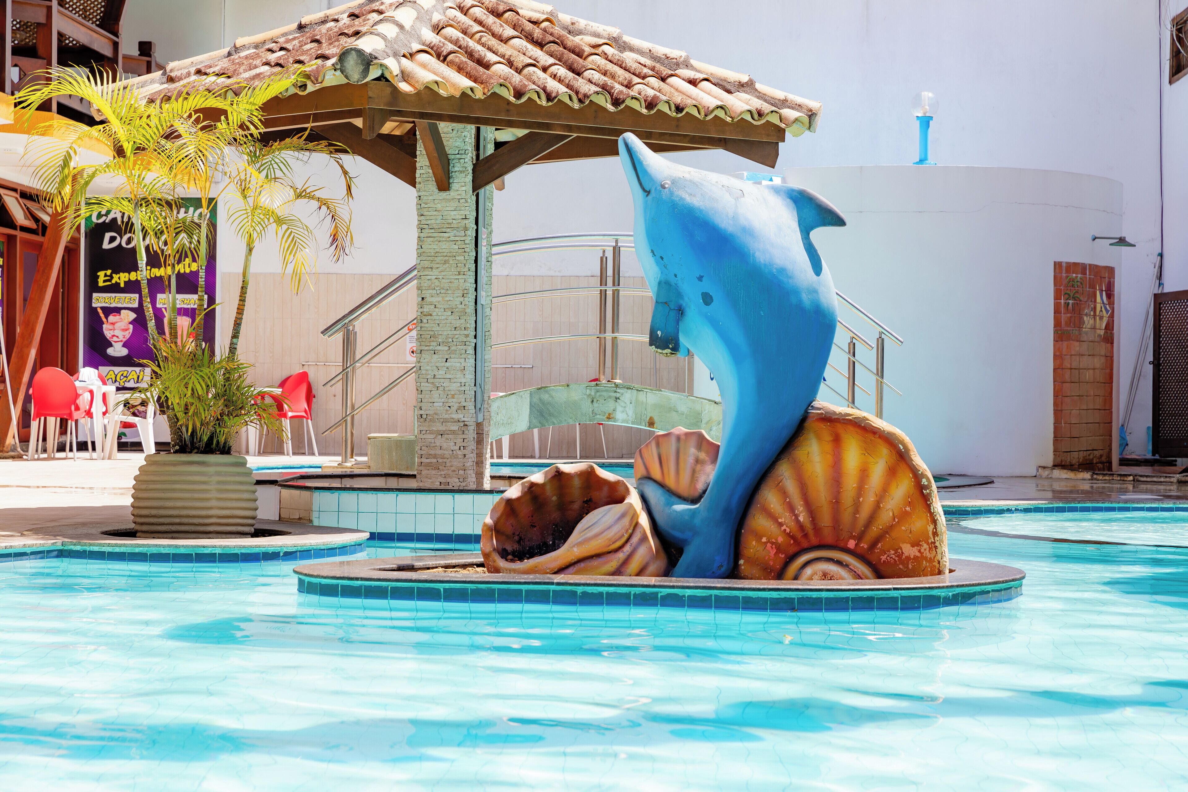 outdoor pool, open 8:00 am to 9:00 pm, pool umbrellas, pool loungers