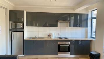 Apartment | Private kitchen | Fridge, microwave, stovetop