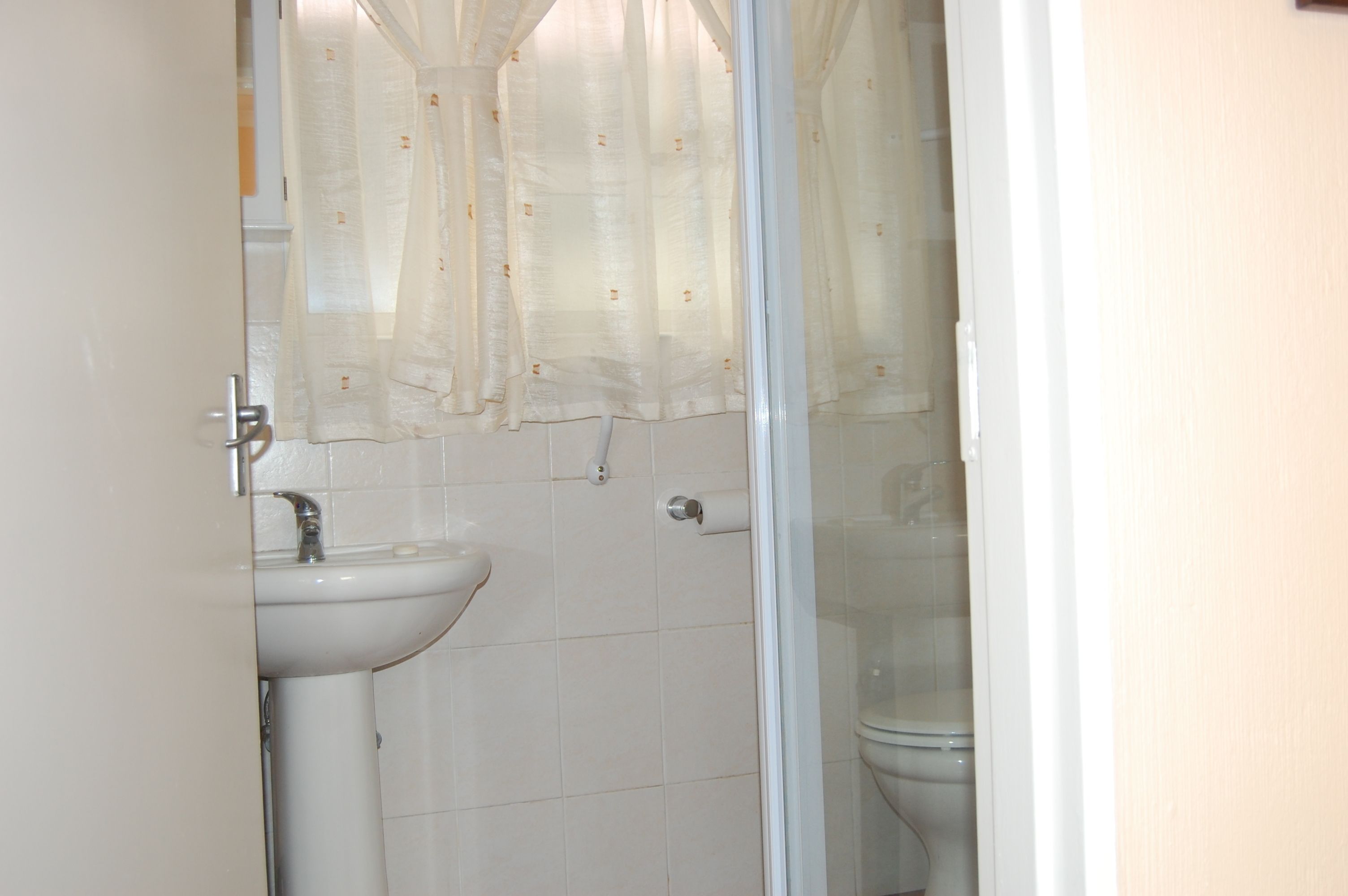 flamingo rest cottage 9 | bathroom | shower, free toiletries, hair dryer, towels