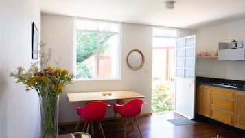 Suite, 1 King Bed | Living room | 38-inch flat-screen TV with cable channels, TV