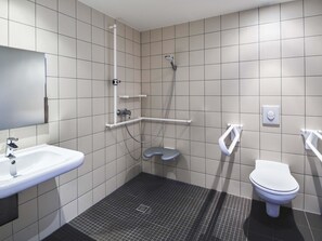 A modern bathroom with a sink, toilet, and shower. - B&B Hotel Frankfurt-Airport (Frankfurt)