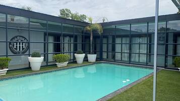 Outdoor pool, open 8:00 AM to 8:00 PM, pool umbrellas, pool loungers