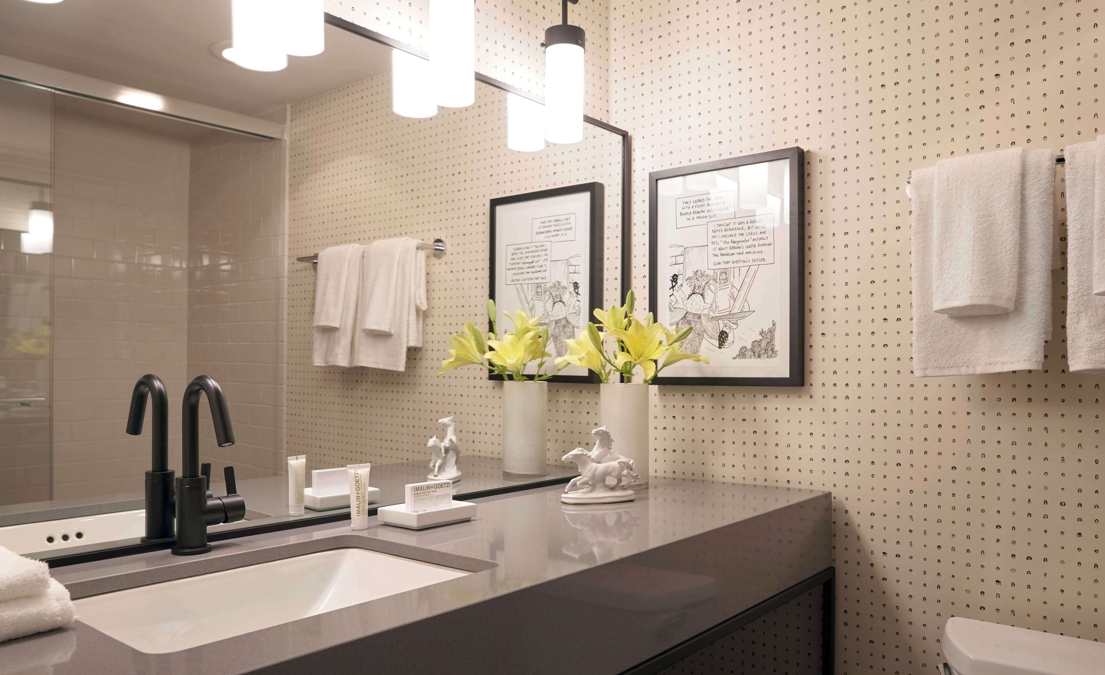 combined shower/bathtub, designer toiletries, hair dryer, towels