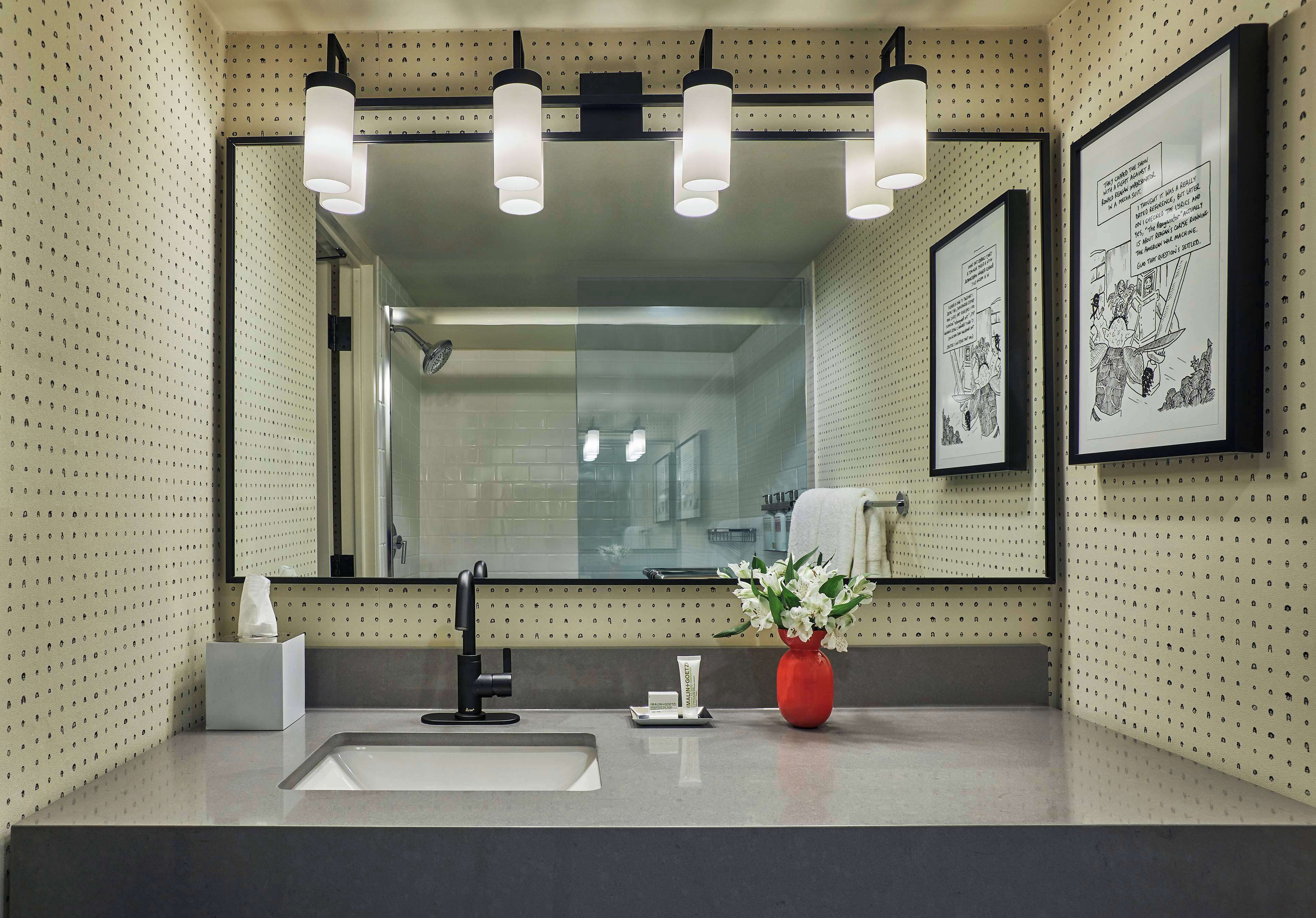 combined shower/bathtub, designer toiletries, hair dryer, towels