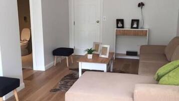 Classic Apartment, Sea View | Living room | Flat-screen TV